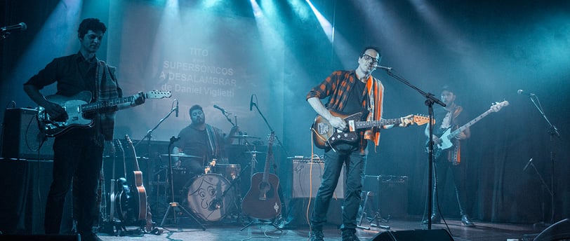 The Supersonicos playing surf music in a concert
