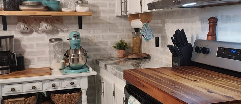a kitchen with a stove top oven and a microwave