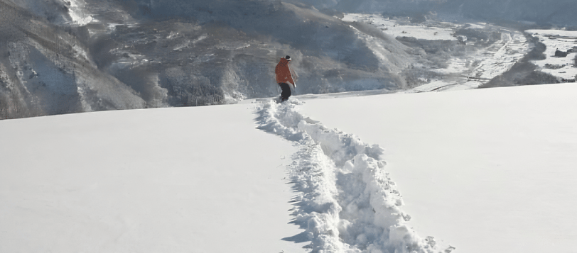 Tom Philp from Travel Plus kids snowboarding in Hakuba Powder