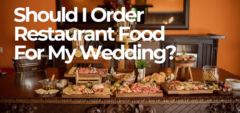 a table with food and drinks on it with the words should i order restaurant food for my wedding