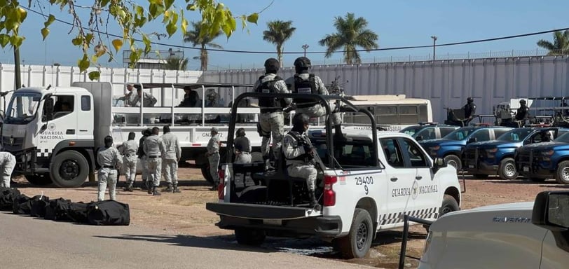 a group of soldiers are gathered around a truck
