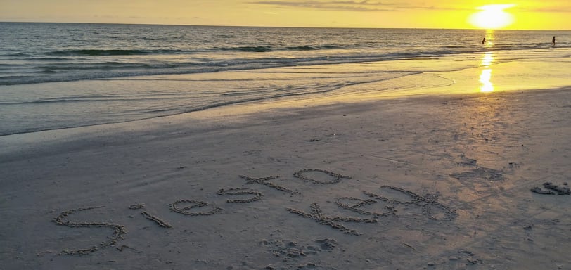 photo of the words Siesta Key written in the sand on Siesta Key