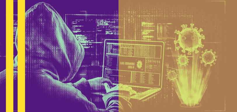 a person in a hoodie is sitting at a laptop
