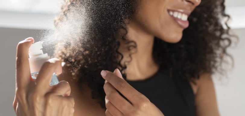 spritzing your hair with hair mists
