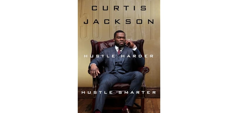 a man in a suit and tie sitting in a chair