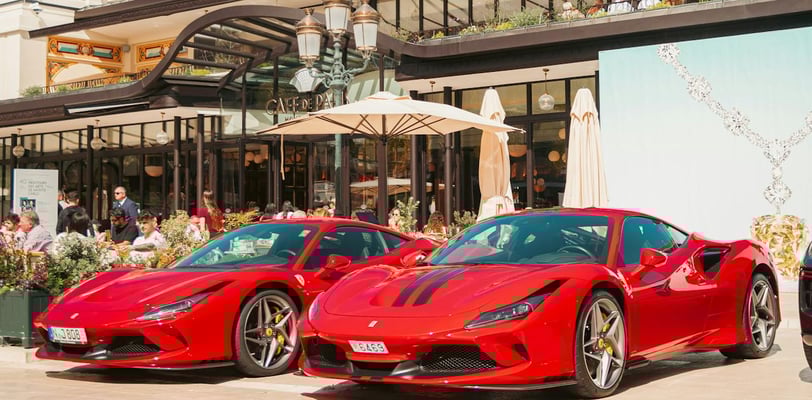 Exotic cars in front of a restaurant during the Monaco Grand Prix