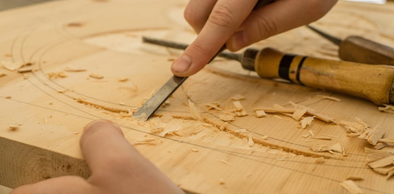 a person is sharpering a knife in a woodworking