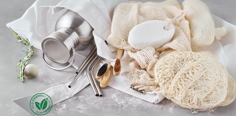 eco-friendly items, including stainless steel straws, bamboo toothbrushes, reusable mesh bags,