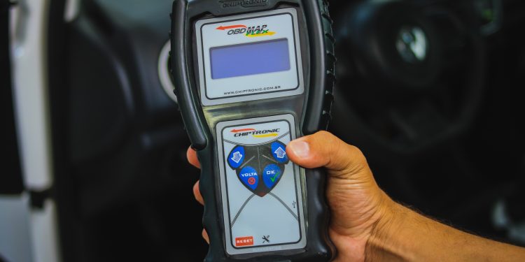 a person holding a cell phone in their hand