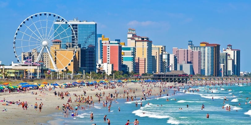 mrytle beach south carolina with people on the beach and a ferris wheel, vacation, sun and fun