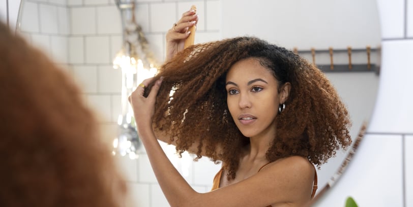 taking care with curly hair with hair tonic