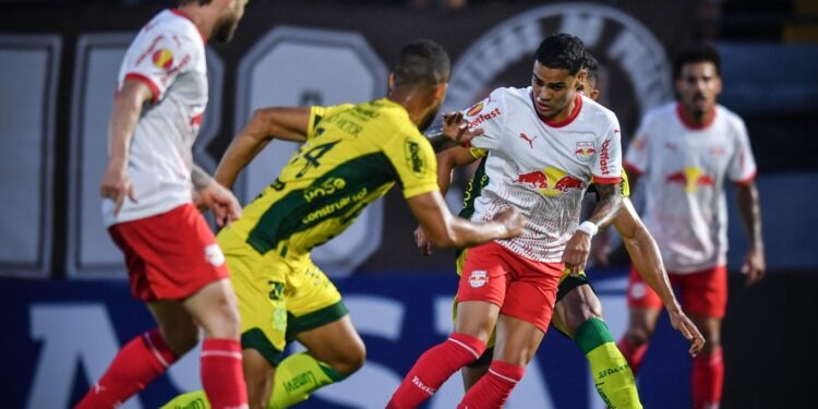 a soccer player is playing soccer in a stadium