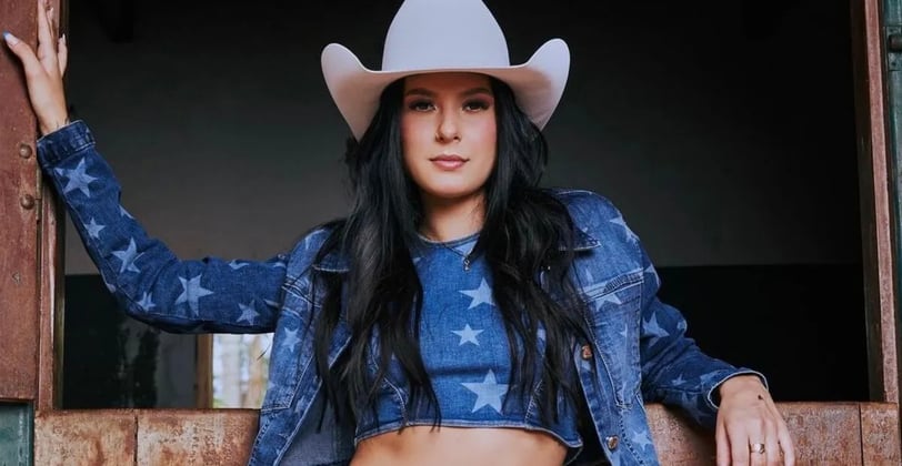 a woman in a cowboy hat and jeans ana castela