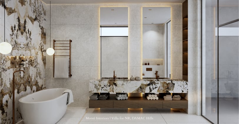 Modern bathroom with double marble vanities, illuminated mirrors, a tub and a heated towel rack