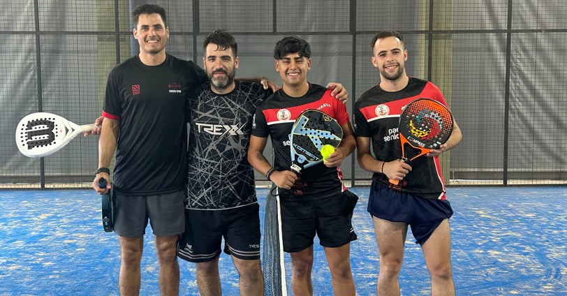 a group of men standing on a tennis court