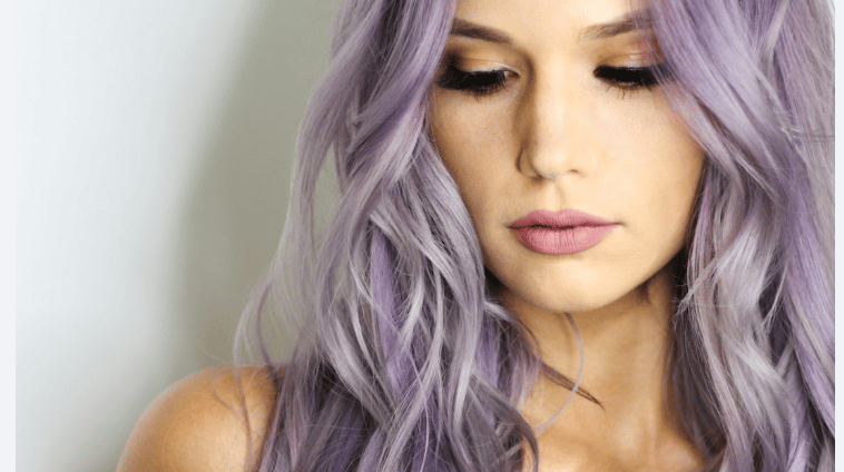 a woman with long hair and purple hair