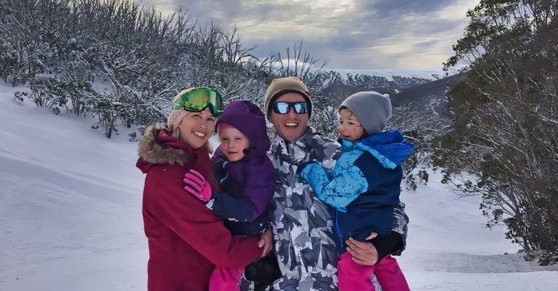 family in snow