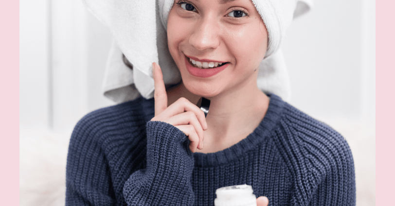 a woman with a towel on her head and a towel wrapped around her head