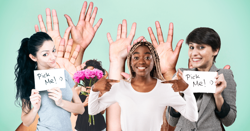 women gesturing with signs and hands asking to be picked