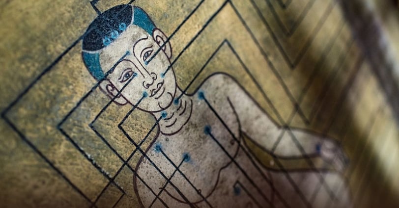 a painting of a man with acupuncture points and ayurveda