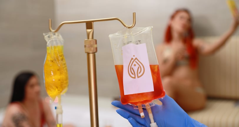 a person in blue gloves holding Iv therapy drip with b complex vitamin c glutathione