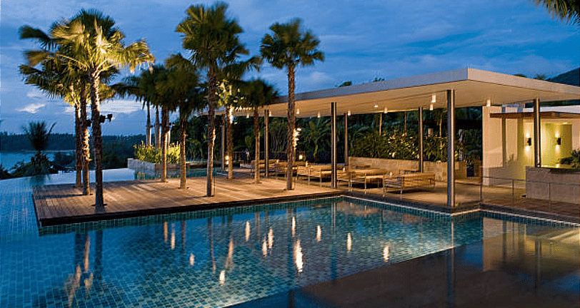 A pool side Hotel exterior patio space to unwind designed mindfully, showcased by shark hotels india