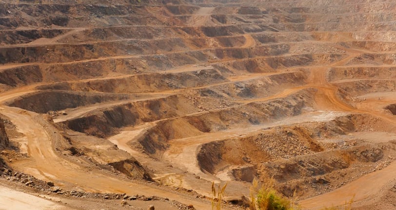 a large open pit hole in a large open pit