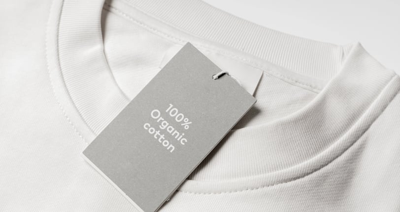 white t-shirt with tag that says '100% organic cotton'