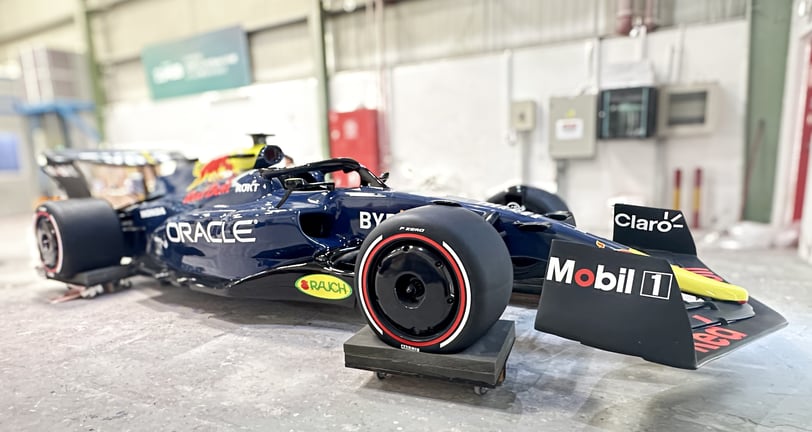 a red bull racing car in a garage