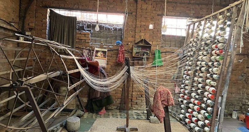 making the TANA or the wrap. then after setting it on the loom, we the weaving of the BANA or weft