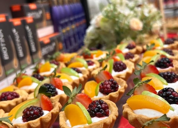 a variety of desserts on display in a store