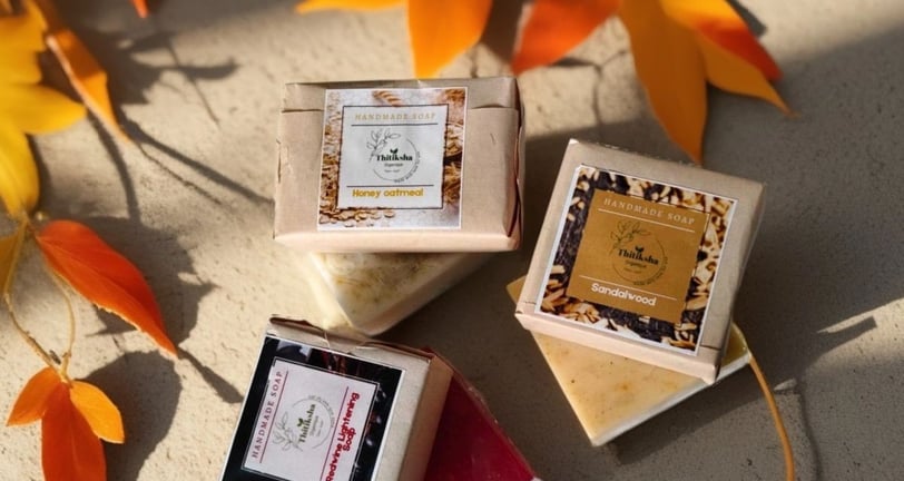 Assorted handmade soap bars with floral accents – natural skincare by Thitiksha Organique