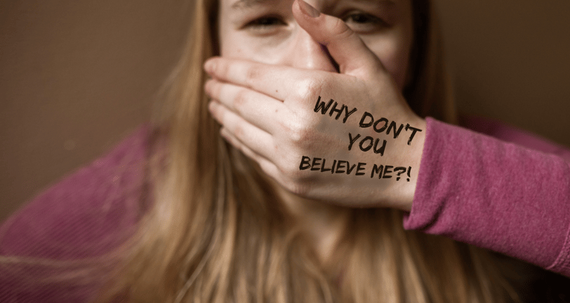 a woman with her hands on her face with a message on her hand