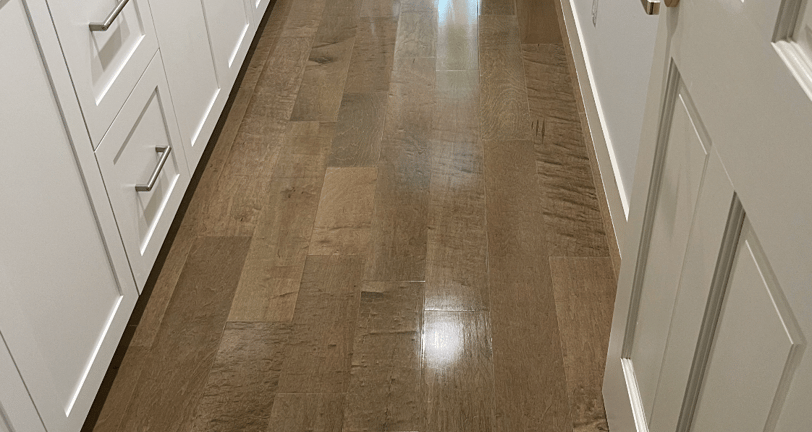 a hallway with a shiny wood floor