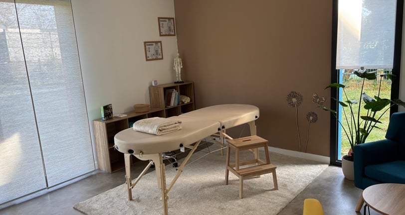 a massage table with a massage table and chairs