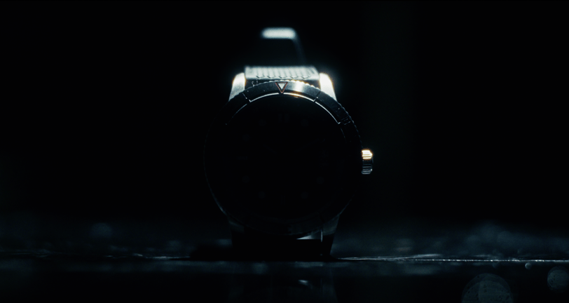 a watch with a black watch face and a watch on it