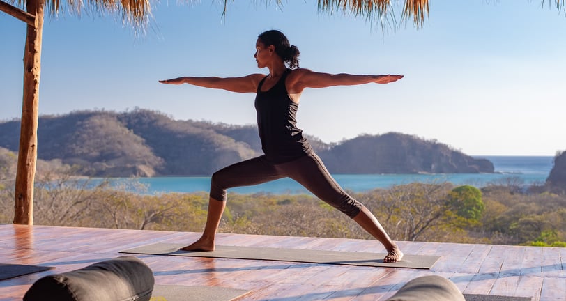 warrior 2 yoga pose in yoga shala retreat center