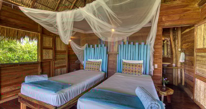 twin beds wooden bungalow retreat center Eden on the Chocolata