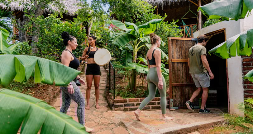 woman walking in Temazcal in tropical garden