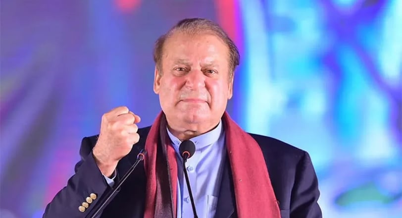 Nawaz Shareef in a local dress suit is giving a speech