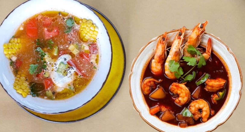 Two bowls of Mexican soups: shrimp in spicy broth and vegetable soup with corn