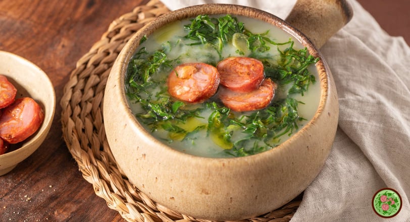 A Portuguese soup with potatoes, kale, and chorizo, topped with olive oil