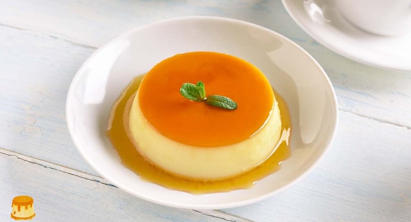 creamy caramel egg pudding topped with a glossy caramel layer, served on a white plate, showing its smooth and rich color 