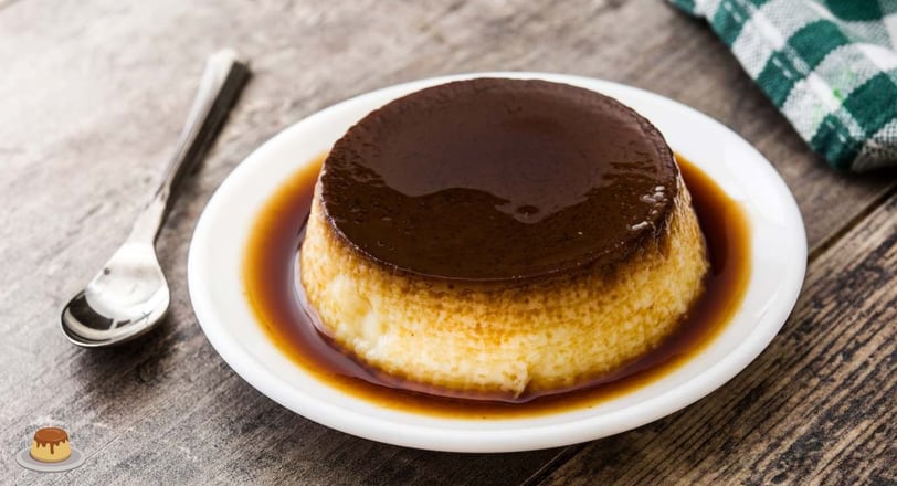 chocolate egg pudding with a silky texture, topped with a drizzle of chocolate sauce, in a white bowl