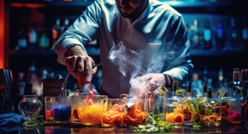 Expert barman making cocktails at the bar