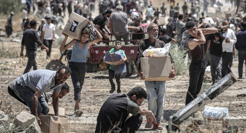 Palestinians suffer from extreme exhaustion after fleeing gunfire near the American aid center in Ga
