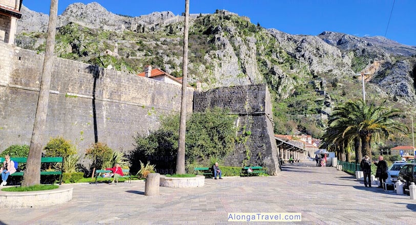 Kotor Fortress can be seen on the top of this white cliff in Old town Kotor