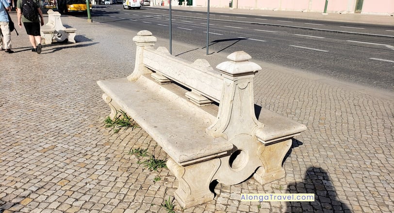 An old bench on old cobblestones on front of the Belem Palace & a shadow of Alonga Travel the author