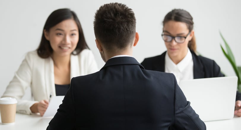 Male candidate interviewed by diverse HR team