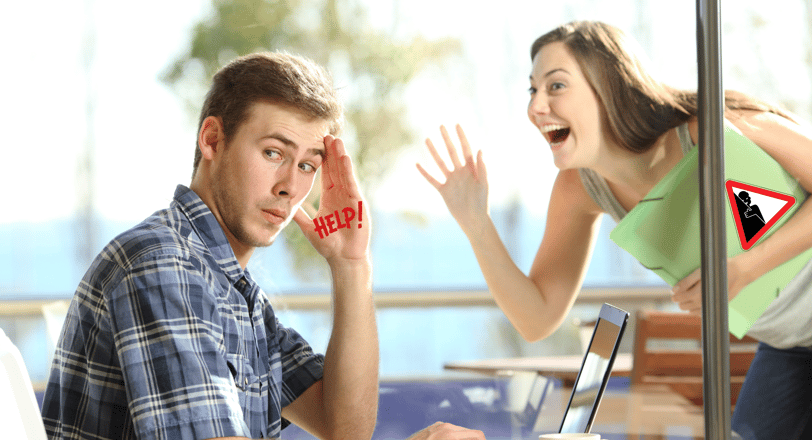 a man sitting at a table with a laptop and a woman waving at him through a window 